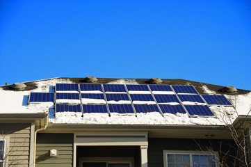 solar panel on the roof after snow in winter