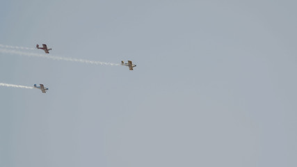 Three small airplanes for agricultural industry flying in the sky