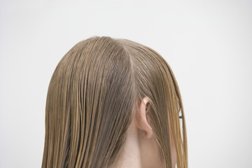 Closeup of female customer with parted wet hair