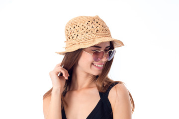 Young woman in straw with sunglasses