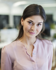 Fototapeta premium Portrait of beautiful young businesswoman in office