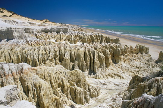 Rock formations and coastline near Canoa Quebrada, Canoa Quedrada, Ceara', Brazil