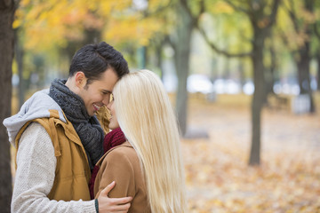 Fototapeta premium Loving couple hugging in park