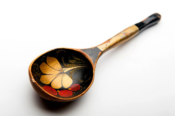 old wooden spoon on white background
