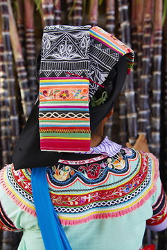 Yi woman at weekly market at Xinjie, Yunnan, China  