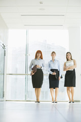 Full-length of confident businesswomen standing in office