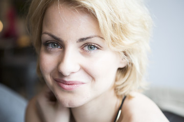 Fototapeta premium Close-up portrait of confident woman in cafe