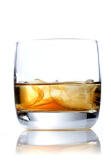 Glass of whisky on white background