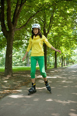 Yong woman riding roller skate