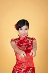 pretty chinese young woman holding red pocket for happy chinese new year