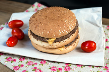 delicious American cheese burger with tomato