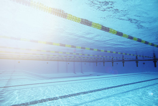 Empty swimming pool with lane markers - Powered by Adobe