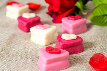Composition for Valentine's day with small heart chocolates - id