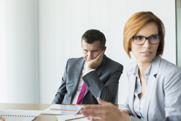 Bored businessman in conference meeting