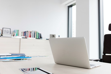 Laptop on desk in office