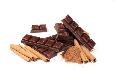 chocolate bars with cinnamon sticks and pile cocoa powder isolated on white background