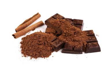 chocolate bars with cinnamon sticks and pile cocoa powder isolated on white background