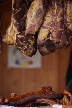 Traditionally homemade cured meat and sausages, smoked, hanged in the market