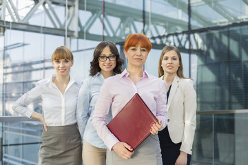 Portrait of confident businesswomen standing together in office