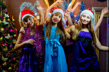 Group of cheerful young girls celebrating Christmas