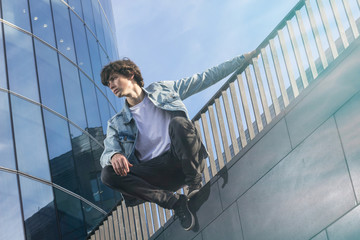 Young man doing parkour in the city