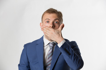 Shocked Businessman covering his mouth