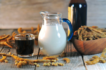 Soybean milk and sauce on a wooden table