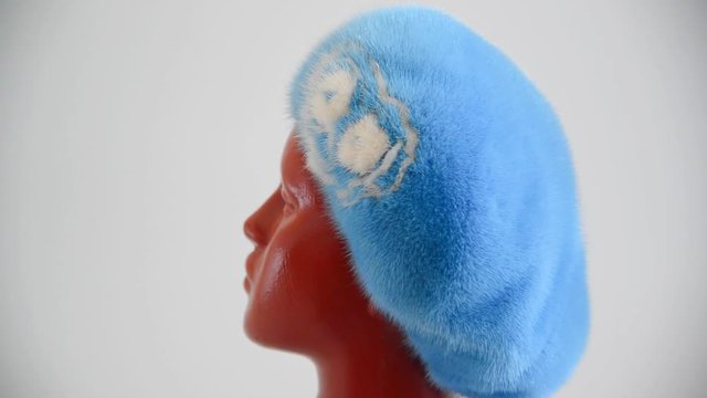 light blue beret from natural mink on mannequin. Side view