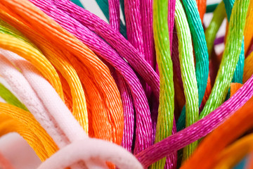 Colorful yarns for handmade and handicraft works. Soft focus on the pink threads