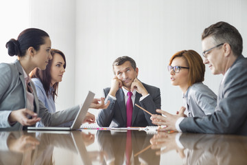 Businesspeople arguing in meeting