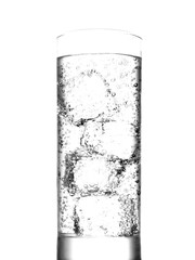 Glass of water with ice cubes on white background