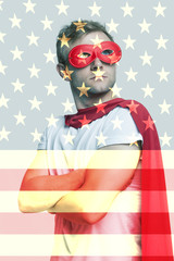Superhero standing over US flag