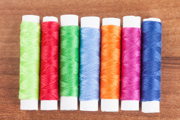 colorful yarn and neeldes for sewing