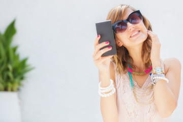 Girl using cellphone outdoors.