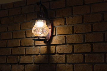 vintage lamp on brick wall background