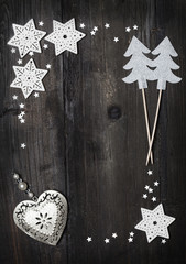 Christmas wooden background with silver colored decorations