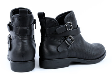 Women blacks boots on a white background