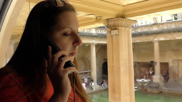 young woman visiting a museum using an audio guide