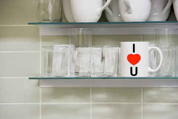 Mug on shelf with the words i love you