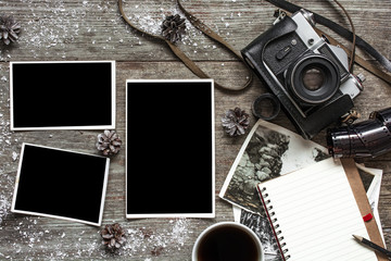 vintage retro camera on wood table background covered with snow