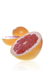 Fototapeta na wymiar Studio shot of halved grapefruits