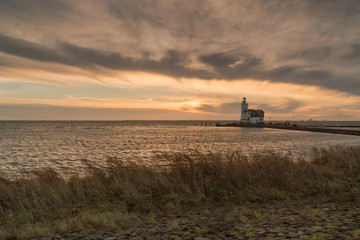 The lighthouse of Marken at sunrise in winter