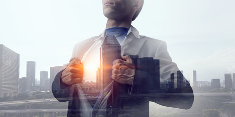 Exposure of businessman and modern city . Mixed media