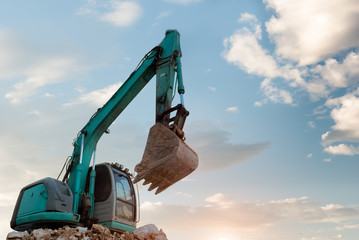 Excavators machine in construction site on blue sky background