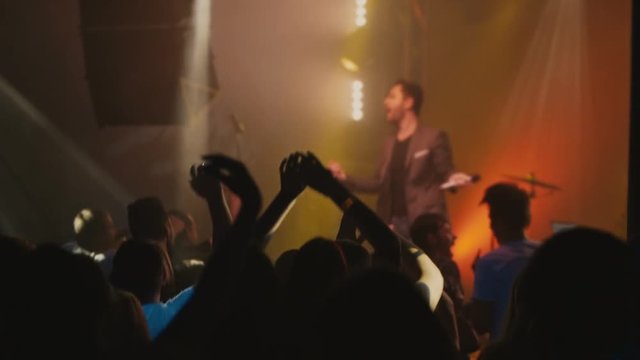 people dancing at live music concert