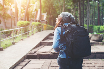 Fototapeta premium Young attractive woman tourist with backpack .