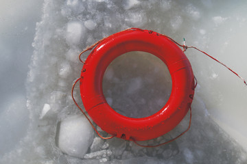 red life buoy on the frozen sea