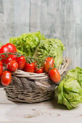 Green fresh roma lettuce salad leaves and roma mini tomatoes - healthy fitness diet