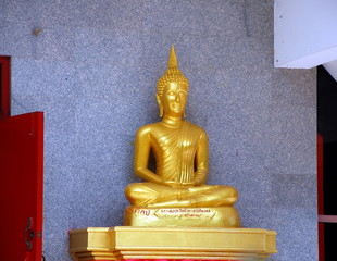 Ancient Golden Buddha in the temple complex Tiger Cave near Krabi, Thailand