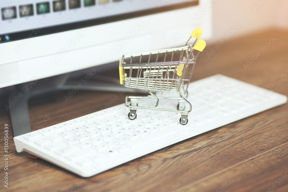 Poster shopping basket on a computer keyboard